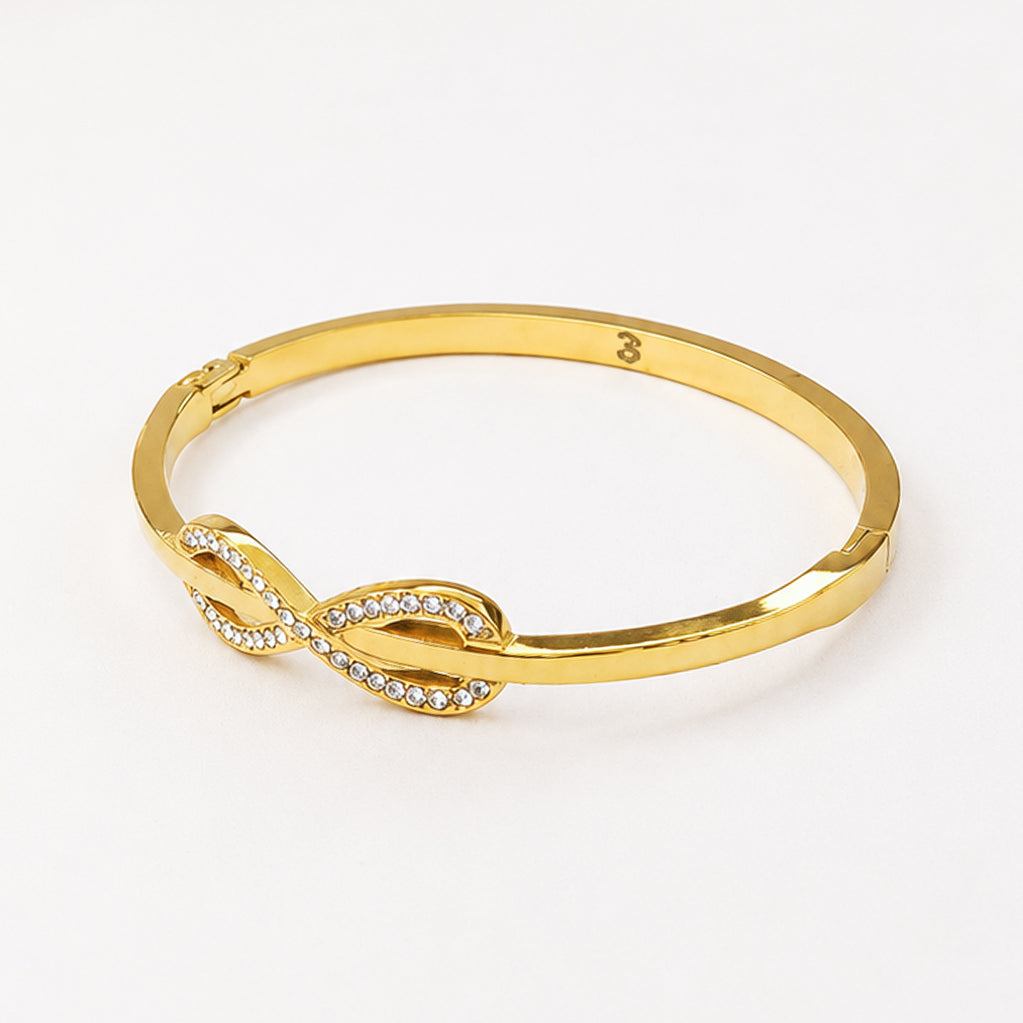 Gold-plated bangle bracelet with a sparkling cubic zirconia infinity symbol charm