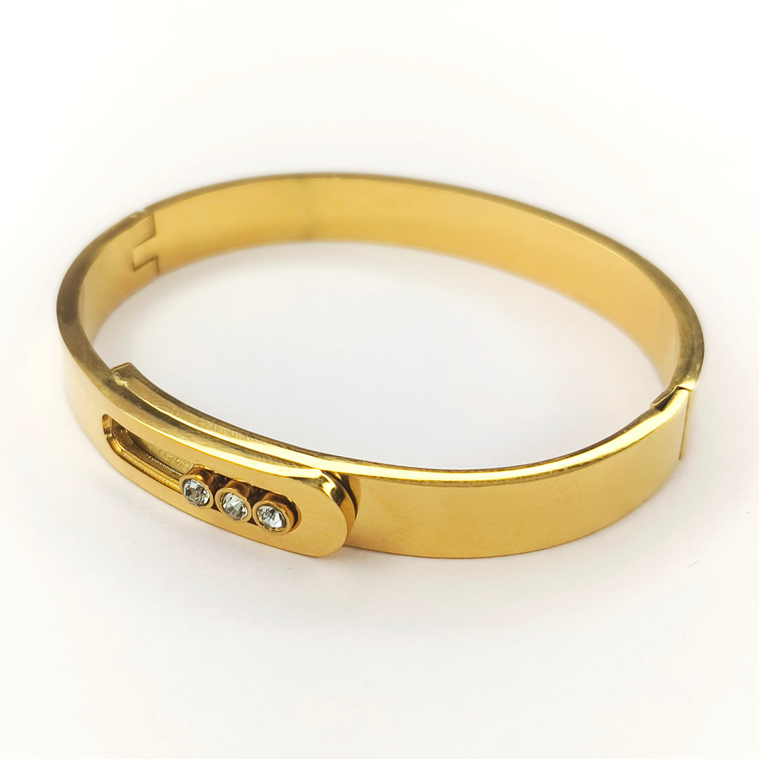 Elegant gold-plated bangle bracelet featuring three inlaid sparkling crystals.