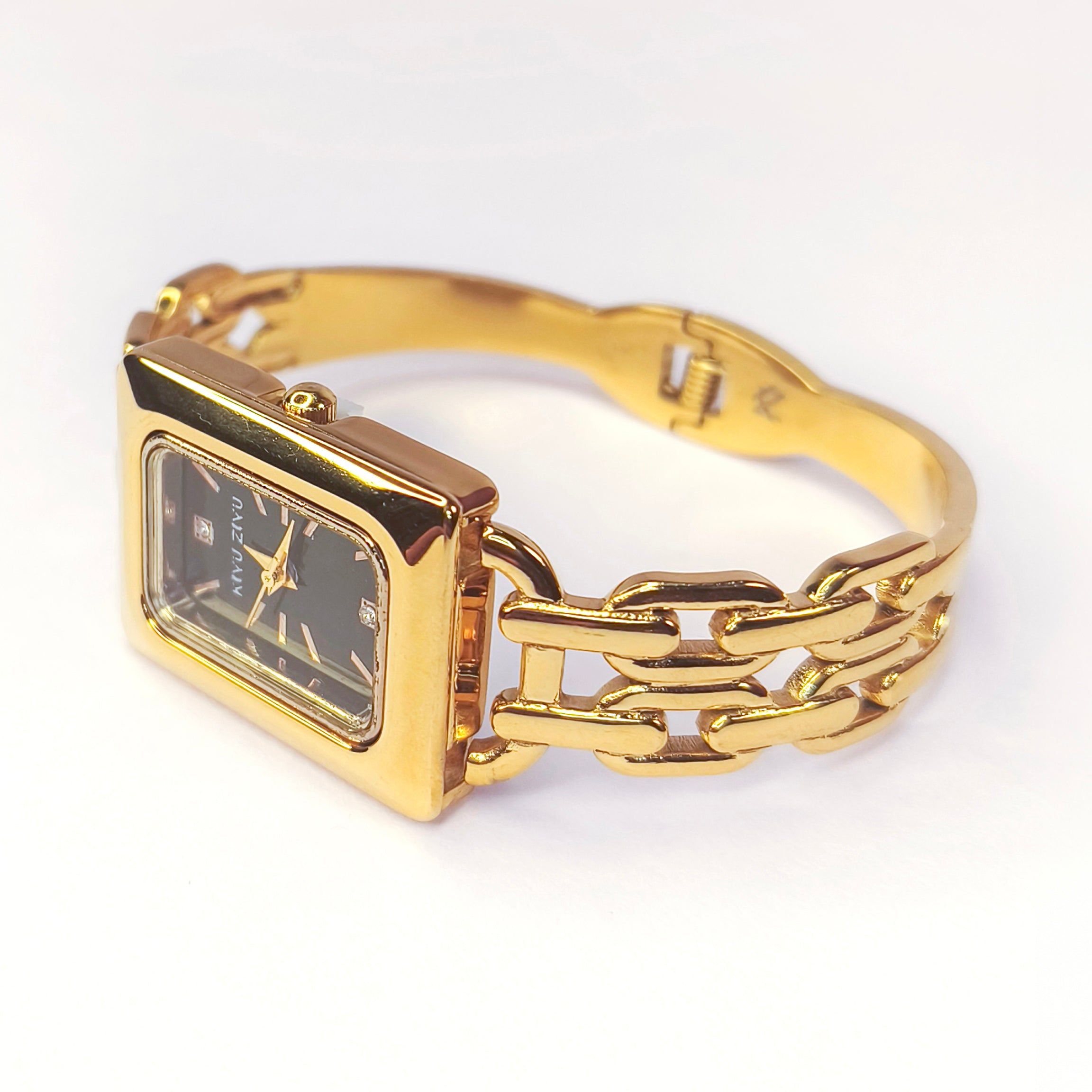 Elegant gold rectangular face ladies wristwatch with a chunky link bracelet