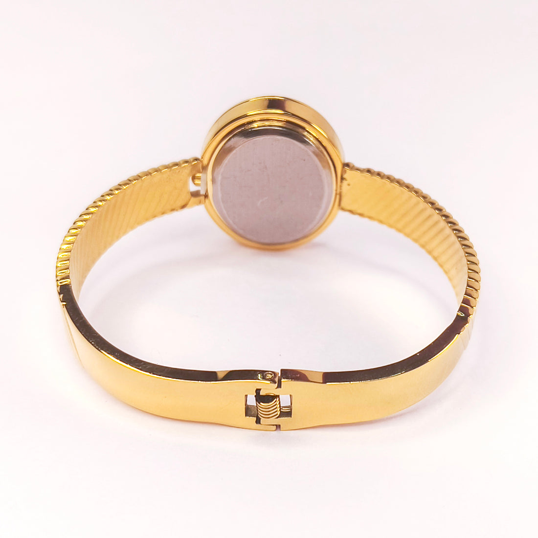 Gold-toned ladies' metal bangle watch with a textured bracelet and round case.